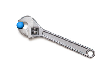 Adjustable wrench with blue ball, isolated on white background