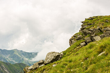 Fototapeta na wymiar View of mountain peaks and rocky trails in summer time, high altitude, Romanian mountains