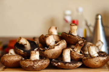 Mushrooms over kitchen wooden board. Healthy food concept.