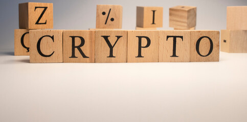 The word Crypto is from wooden cubes. Background from wooden letters.