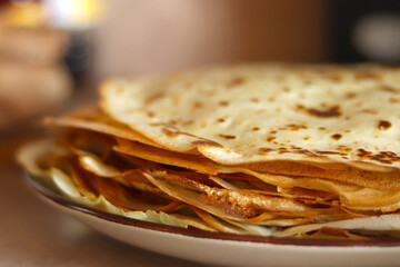 Crepes, thin pancakes on the plate. Food concept background.