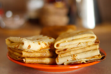 Crepes, thin pancakes on the plate. Food concept background.