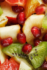 Fruit salad close-up in full screen, as a background.