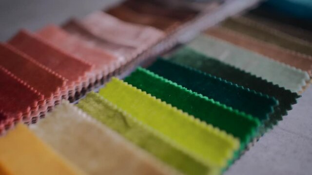 closeup of fabric colorful velvet samples palette at textile showroom
