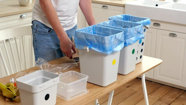 Ecology. Waste sorting. Recycle plastic, metal, glass, paper, organic waste. Prevention of environmental pollution. A container for sorting and processing household waste. Waste separation concept