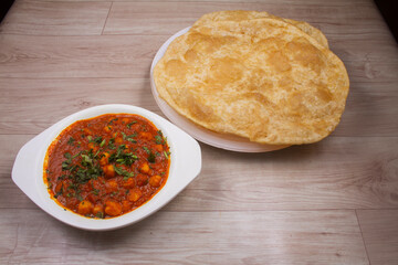 Traditional North Indian fastfood called Chola Bhaatura or Chole Bhature preferred in all meals breakfast, lunch and dinner