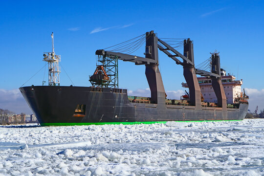 The Dry Cargo Ship Moves Along The Forway In The Ice Of The Gulf Of Finland. The Unit Is Fully Loaded.