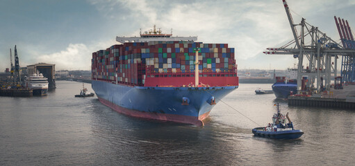 Container terminal in the port of Hamburg with large container ship and tugs - obrazy, fototapety, plakaty