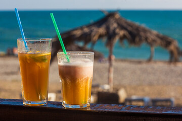 cocktail on the background of the sea and the beach	
