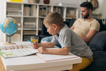 father do homework with his son at home