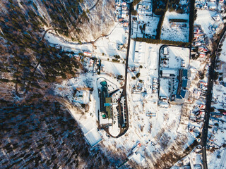 Aerial landscape of Sinaia, for a mountain getaway or a winter vacation in a beautiful place. The city of Sinaia seen from above. Valea Prahovei mountain tourism season in Carpati Mountains, Romania