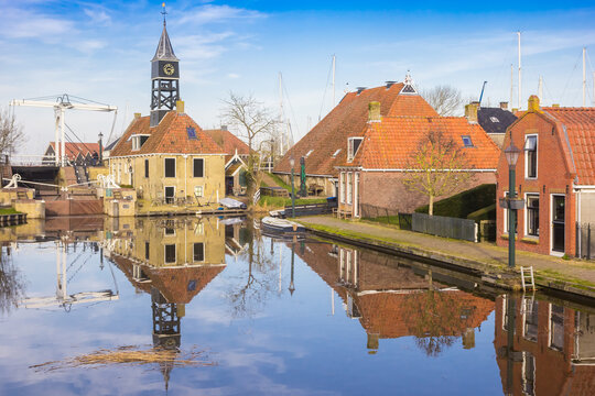 Lock building with clock tower in historic city Hindeloopen, Netherlands