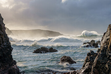 In dark and stormy conditions the mighty Atlantic Ocean crashes onto the Mangersta coastline, Uig, Isle of Lewis, Scotland. © Derek