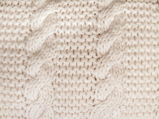 Fototapeta na wymiar Close up of off white cable knit stitch pattern