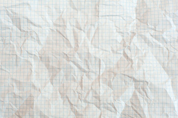 Texture of crumpled white paper in a cage, school notebook. White background 