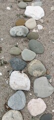 Backgrounds and textures: sand and a path made of large pebbles.