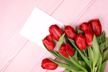Greeting Card mockup beautiful tulips and place for text. Flat lay template with copy space. Photography for design.