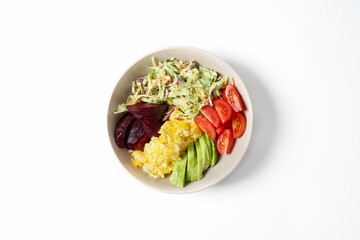 Bowl with scramble egg cabbage avocado beetroot and tomato