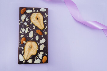 Natural handmade chocolate close-up on a bright background.