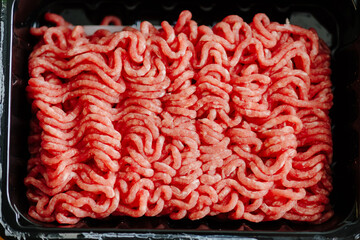 Ground beef in a plastic tray.