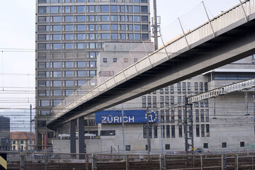 Naklejka premium Viaduct Negrellisteg over the track field of Zurich railway main station with huge sign of Zurich. Photo taken March 10th, 2021, Zurich, Switzerland.