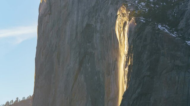 Time lapse of Firefall, a seasonal waterfall illuminated by the late sunlight in Yosemite National Park in California