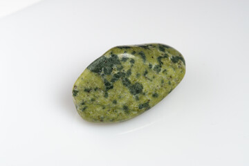 Natural stone green serpentine on a white background