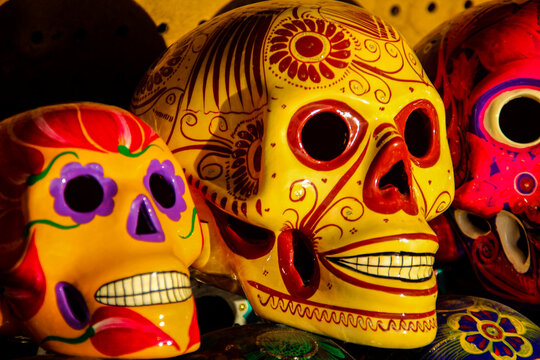 Calacas, wooden skull Day of the Dead masks on market in Cabo San Lucas, Mexico