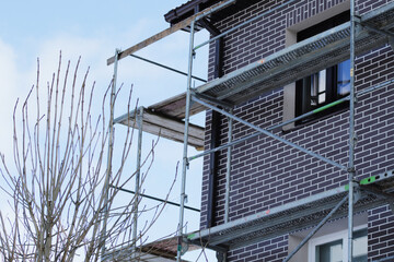 Fototapeta na wymiar steel scaffolds on renovating house