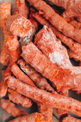 Many red corals on a white background. Top view. Copy, empty space for text