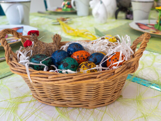Easter. Painted eggs in a basket on the table at home