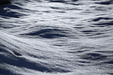 Frozen snow illuminated by sunlight, Italy