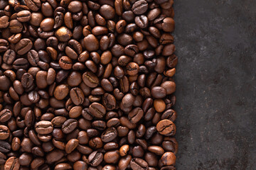 Roasted coffee beans on a dark background