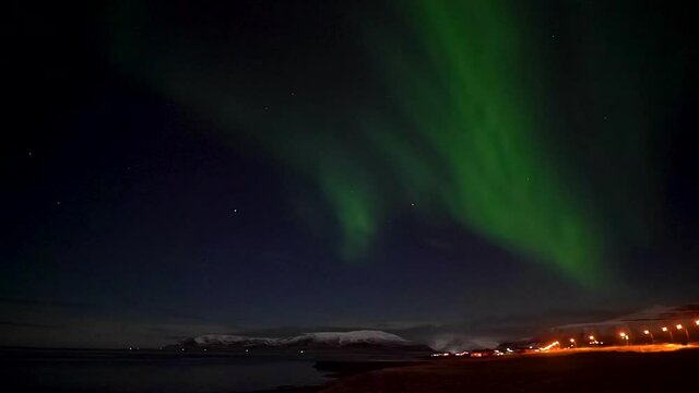 Strong Northern Lights Above Grundarfjordur Town In West Iceland - real time video.