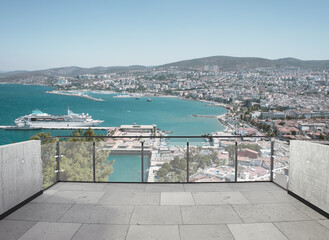 Fototapeta na wymiar View from the balcony to the sea.Landscape. Sunny Day. Terrace with a beautiful view. Background with beautiful landscape. City near the sea.