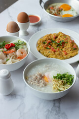 American and Thai breakfast set on the marble background