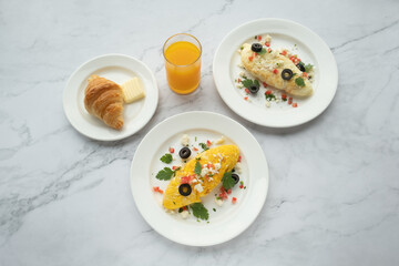 American and Thai breakfast set on the marble background