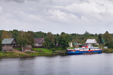 Volkhov River coastal landscape with rural houses