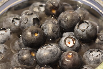 A pile of blueberries in water