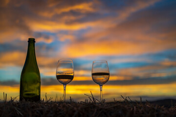 glass of wine with sunset in late summer