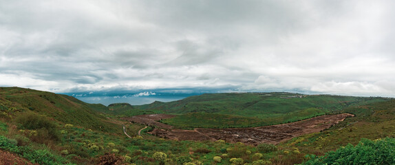 Panorama of the Kinneret lake on the background of beautiful clouds