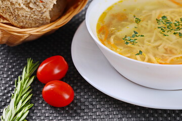 A bowl of healthy chicken noodle soup