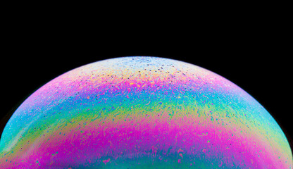 Panoramic view of closeup bubble textured backdrop representing colorful planet with wavy lines on round shaped surface on black background
