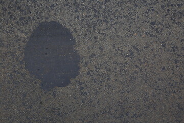 Gray Asphalt with Bitumen Spot Close Up Background
