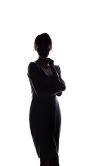 silhouette of beautiful girl confidently looking forward, figure of young woman with arms folded on chest on white isolated background