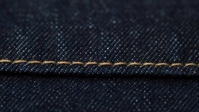 dark blue denim jeans macro. stitching on jeans