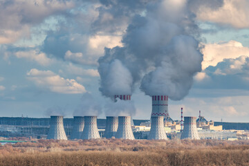 Nuclear power plant with Cooling tower of Atomic power station. Industrial zone with emission of...