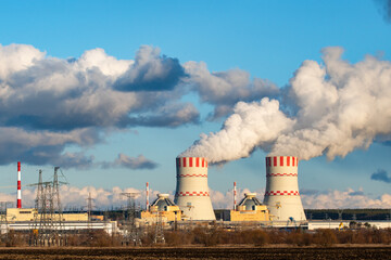 Nuclear power plant with Cooling towers of Atomic energy power station with emission of steam in the air atmosphere.