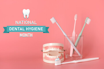 Tooth brushes and model of jaw on color background. National Dental Hygiene Month