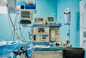 Cardiac event monitor and various modern medical devices in operating room during surgery